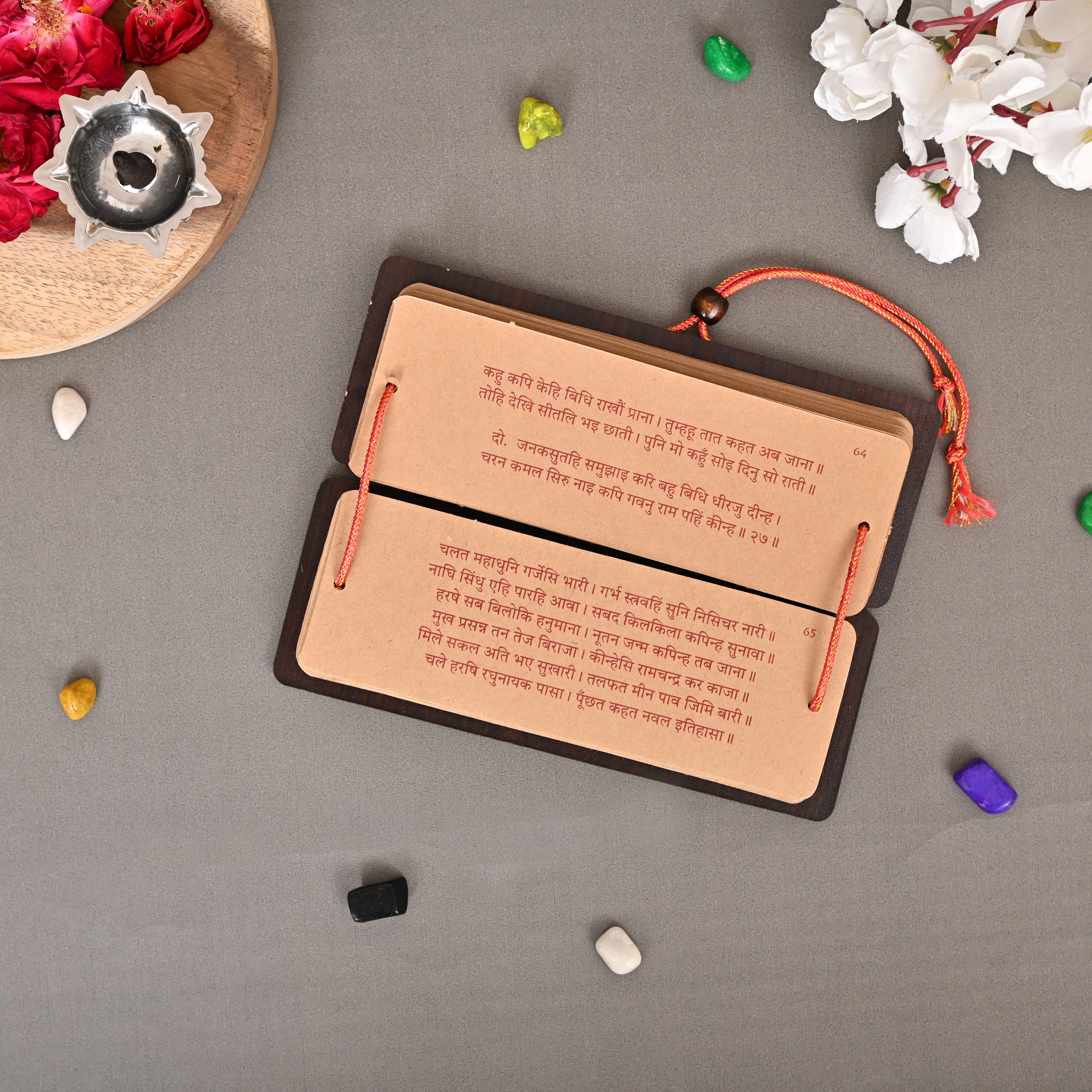 Open Sundarkand pandulipi showing thread-bound wooden cover and parchment-style pages
