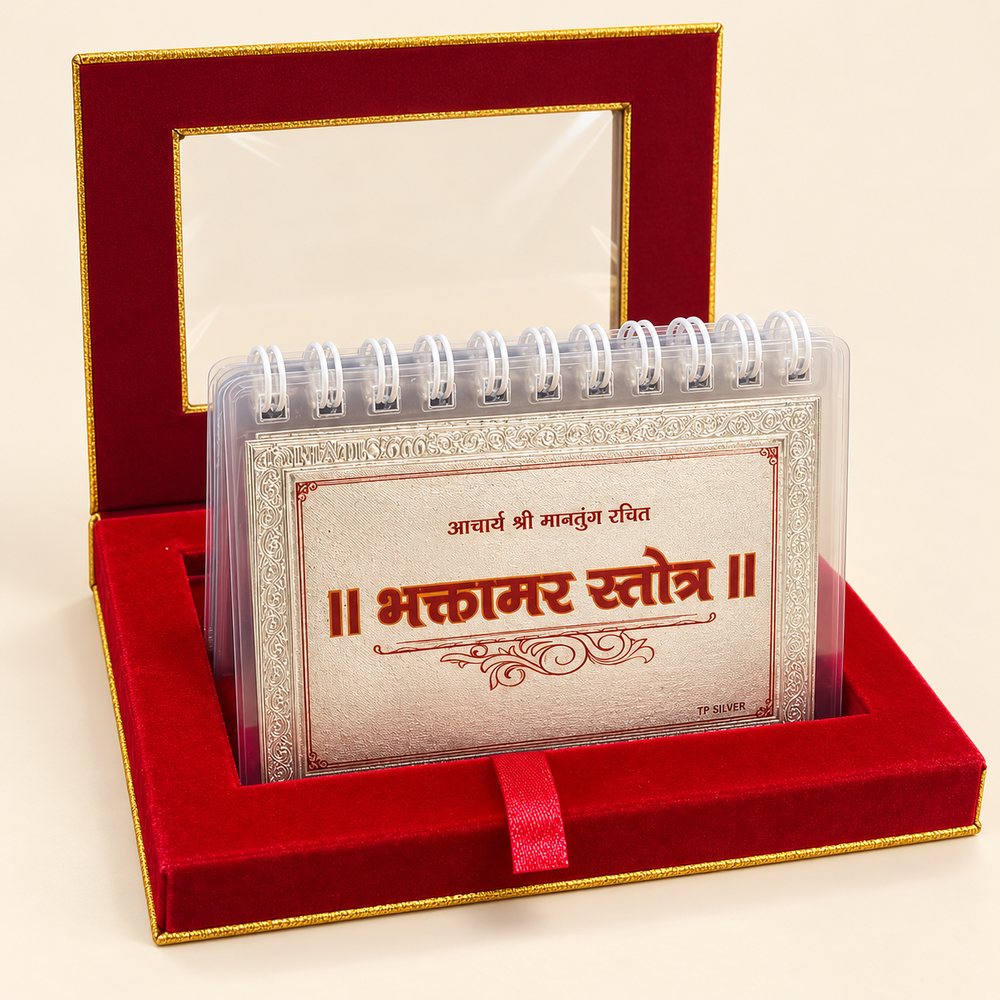 Silver Bhaktamar Stotra flip book standing open in a red velvet gift box